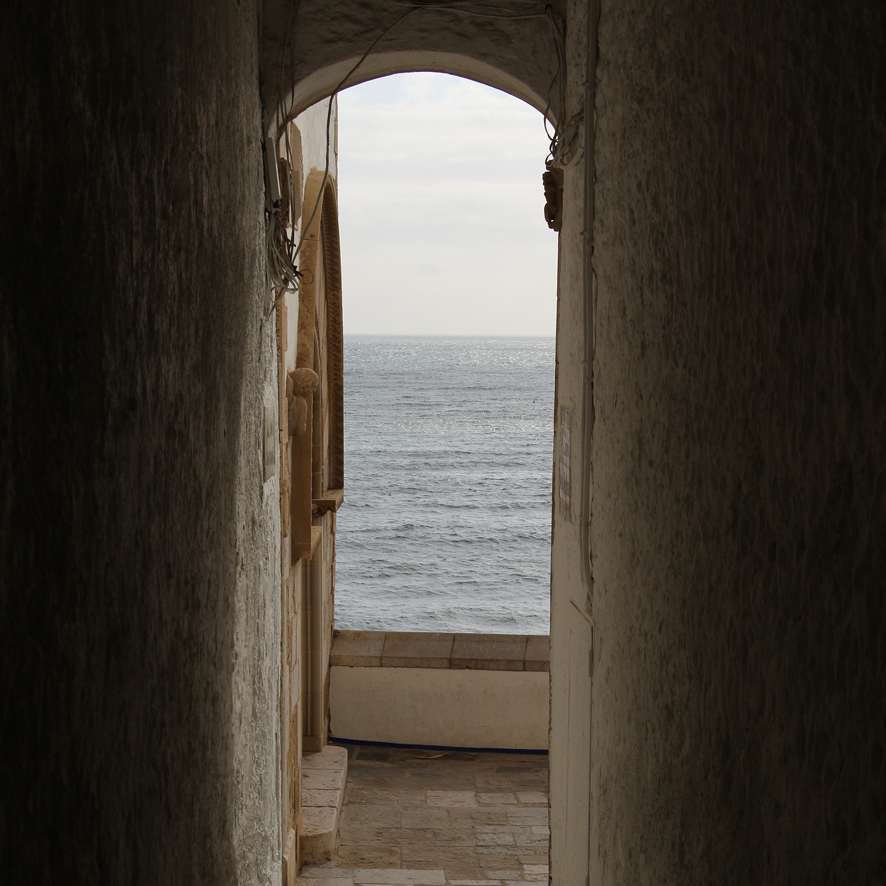 A photo of a doorway overlooking the sea.